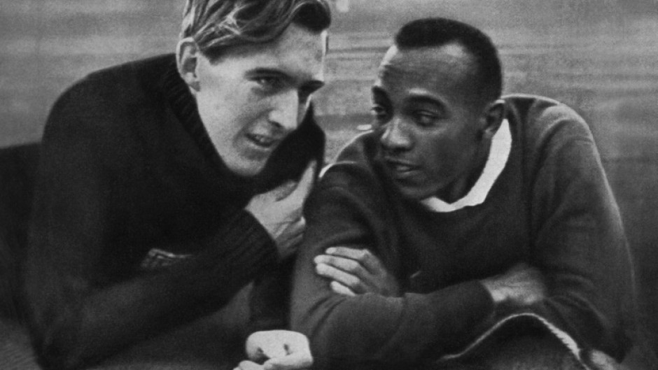 Jesse Owens and Luz Long chat at the Berlin Olympic Stadium during the 1936 Games