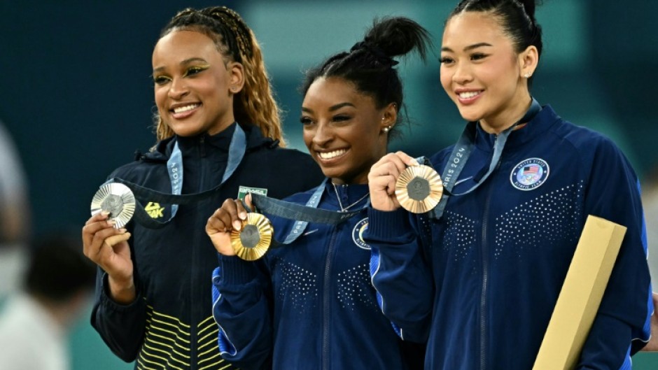 Brazil's Rebeca Andrade and Americans Simone Biles and Sunisa Lee pose with their Olympic gymnastics all-around medals