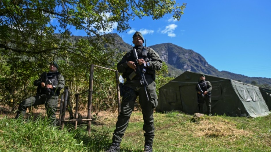 Colombian special forces stand guard at Farallones de Cali National Natural Park on the outskirts of Cali on July 6, 2024, during security operations ahead of the upcoming COP16 Summit