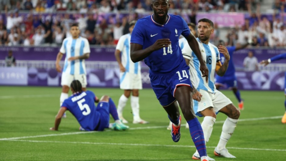 Jean-Philippe Mateta runs away in celebration after scoring for France against Argentina