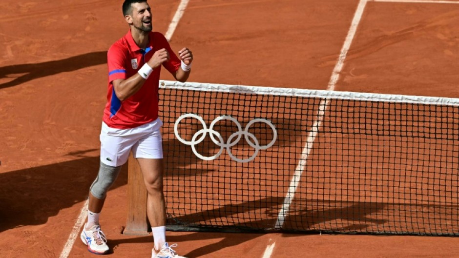 Serbia's Novak Djokovic celebrates becoming Olympic champion