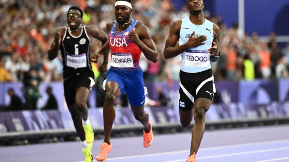 Letsile Tebogo crosses the line after winning the Olympic men's 200m with ease