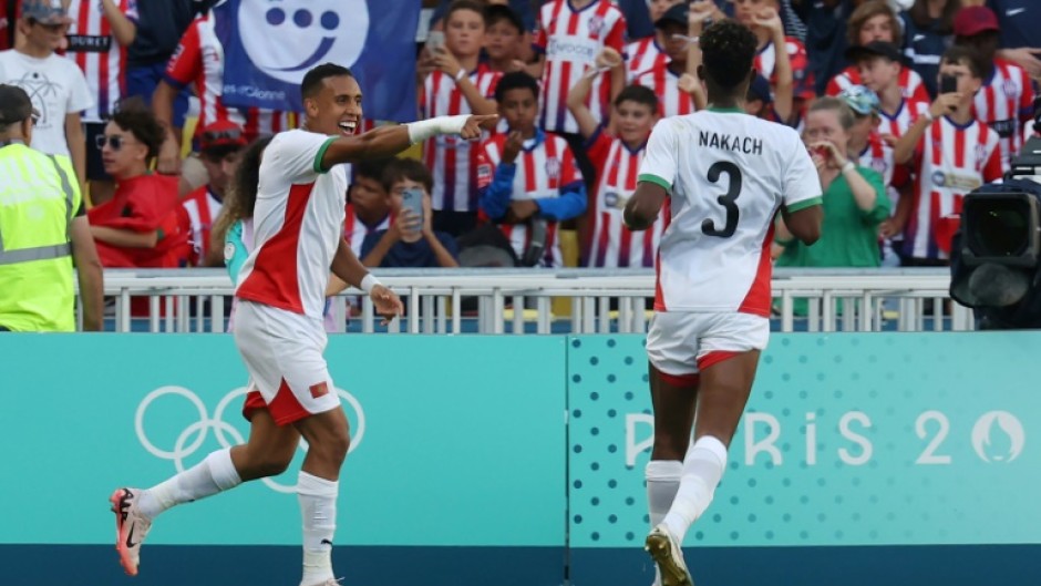 Soufiane Rahimi (L) celebrates scoring Morocco's fourth goal as they hammered Egypt 6-0 on Thursday to take Olympic men's football bronze 