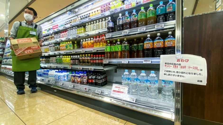 A sign telling customers the sale of water is rationed at a supermarket in Sumida district of Tokyo