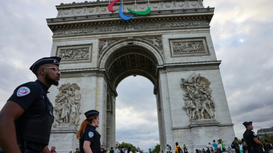 The symbol of the Paralympic movement adorns the Arc de Triomphe