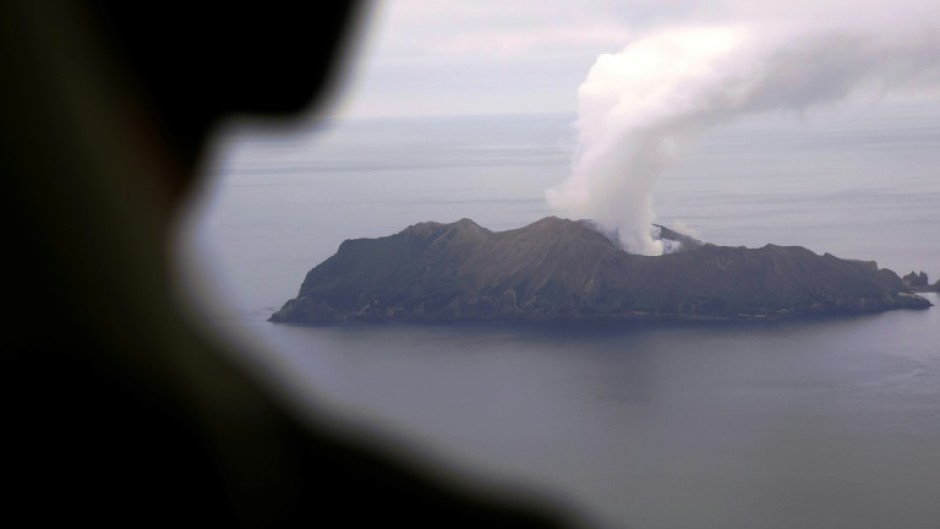 Volcanic ash from an eruption at the White Island volcano grounded some flights in New Zealand on Thursday