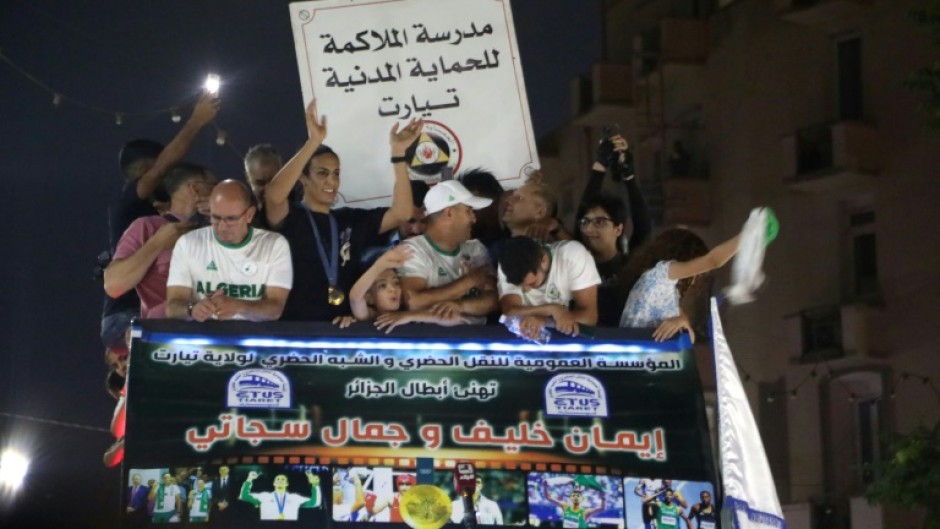 Khelif paraded through Tiaret in an open-top bus