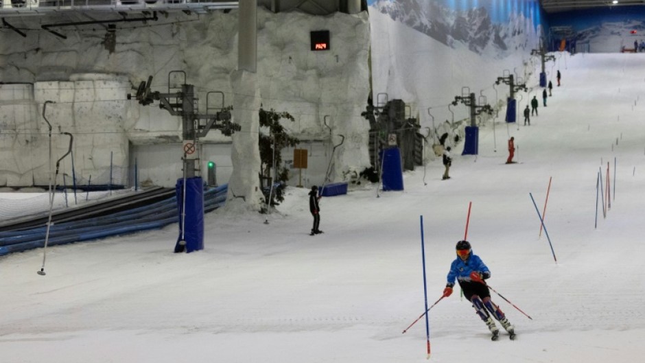 A shopping mall in Arroyomolinos near Madrid houses a 250-metre indoor slope covered in artificial snow, allowing customers to ski even during Spain’s scorching summers