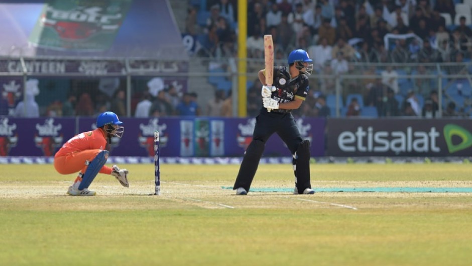 Afghan Cricket players from the Speen Ghar Tigers team (Orange) play against the Mis-e-Ainak Knights (Black) during Afghanistan's leading T20 cricket league 'Shpageeza' at the Kabul Cricket Stadium in Kabul, on August 22, 2024