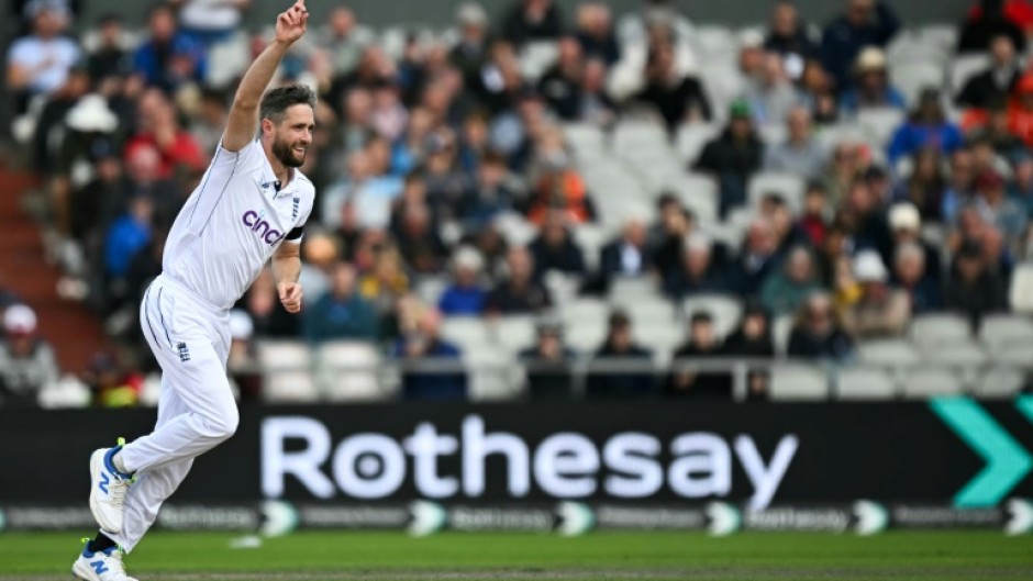 Success: England's Chris Woakes celebrates bowling out Sri Lanka's Nishan Madushka in the first Test at Old Trafford