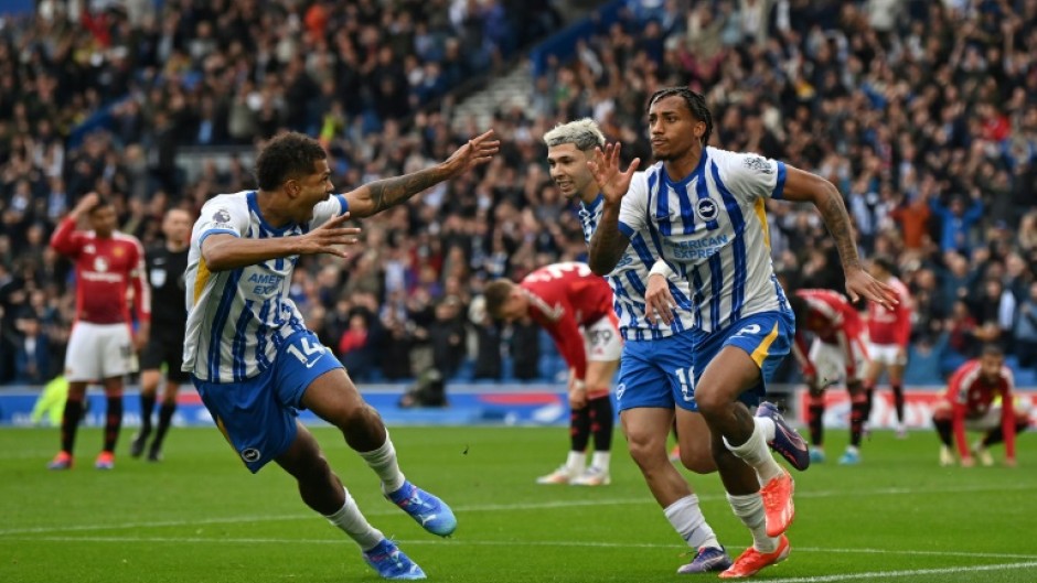 Brighton's Joao Pedro (R) celebrates scoring the winner against Manchester United