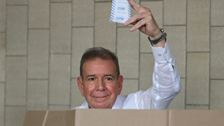 Venezuelan opposition presidential candidate Edmundo Gonzalez Urrutia shows his ballot as he votes in Caracas during the July 2024 presidential election