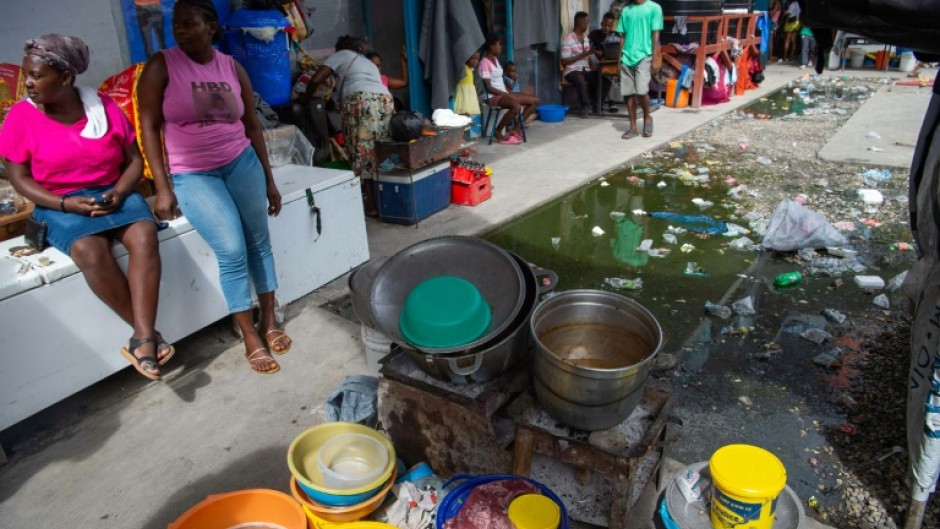 Vendors sell soup near a displacement camp in Port-au-Prince, Haiti in August 2024