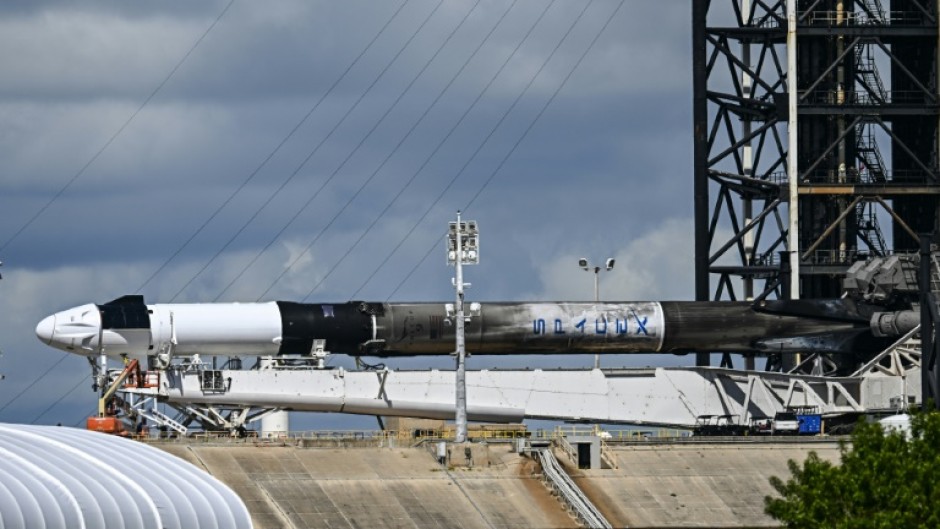 A SpaceX Falcon 9 rocket with the Crew Dragon Resilience capsule sits on Launch Complex 39A at Kennedy Space Center