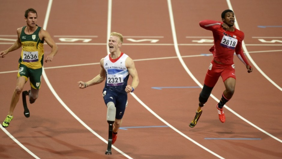 Britain's Jonnie Peacock (C) says he is now the hunter not the hunted and ready to regain his Paralympic 100m title 