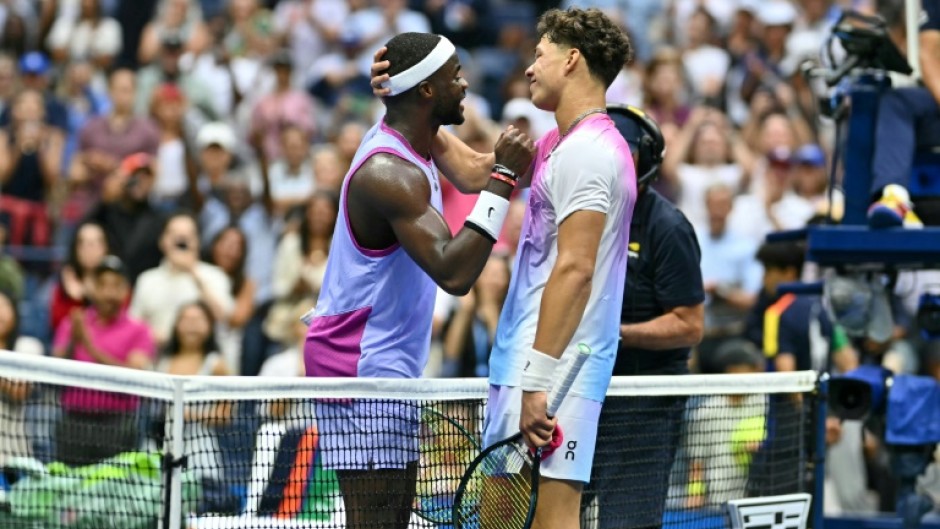 Frances Tiafoe and Ben Shelton shake hands after Tiafoe's victory in their all-American US Open third-round match