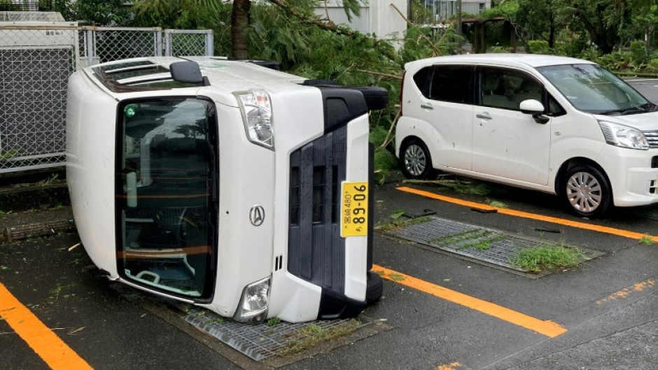 A car overturned by strong winds from Typhoon Shanshan in Miyazaki