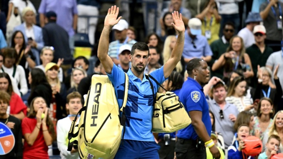 All over: Novak Djokovic waves at the crowd after his defeat against Australia's Alexei Popyrin 