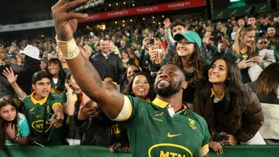 South Africa captain Siya Kolisi takes a selfie with supporters after a 2024 Rugby Championship victory over New Zealand in Johannesburg.