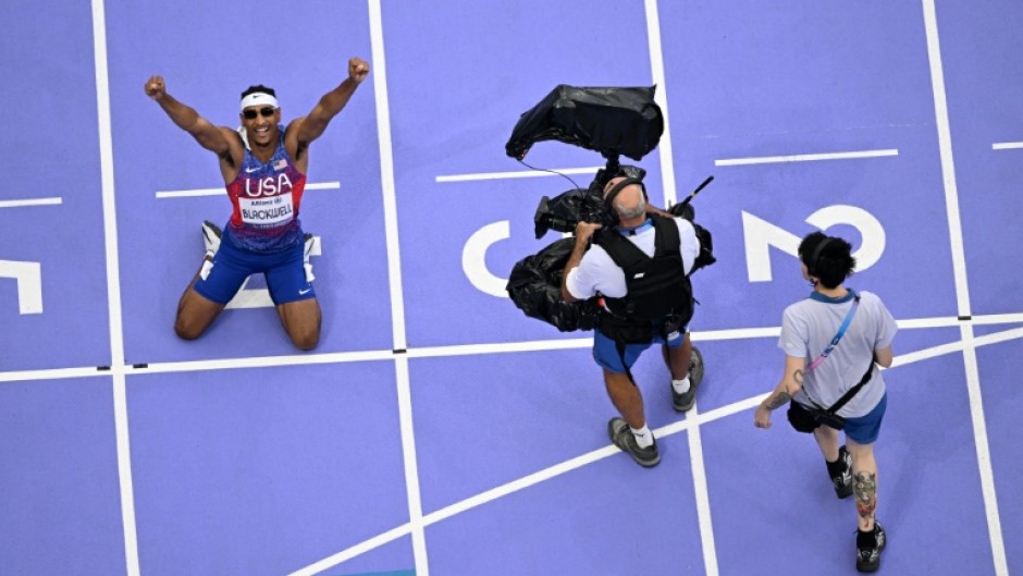 US sprinter Jaydin Blackwell celebrates after winning his country's first track and field gold medal of the Paris Paralympics