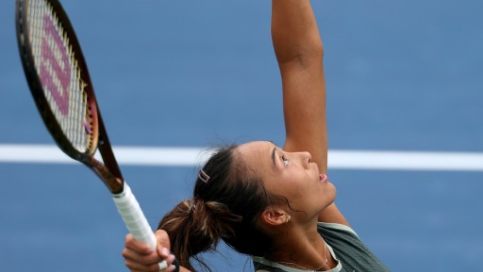 Zheng Qinwen serves in her US Open victory over Jule Niemeier