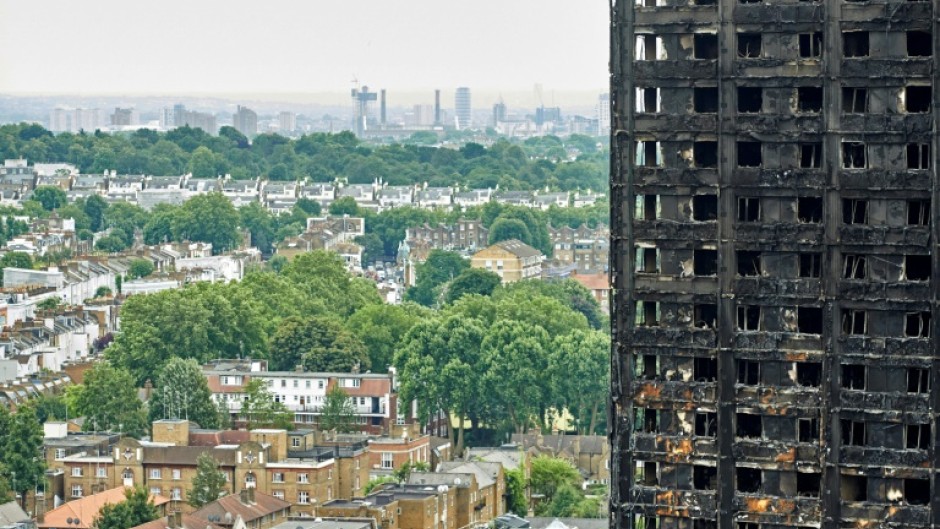 A first report by a public inquiry into the 2017 tragedy laid the bulk of the blame for the fire's rapid spread across the building on its highly flammable cladding