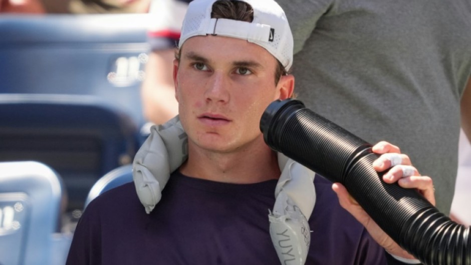 Model of consistency: Jack Draper cools off during his match against Tomas Machac 