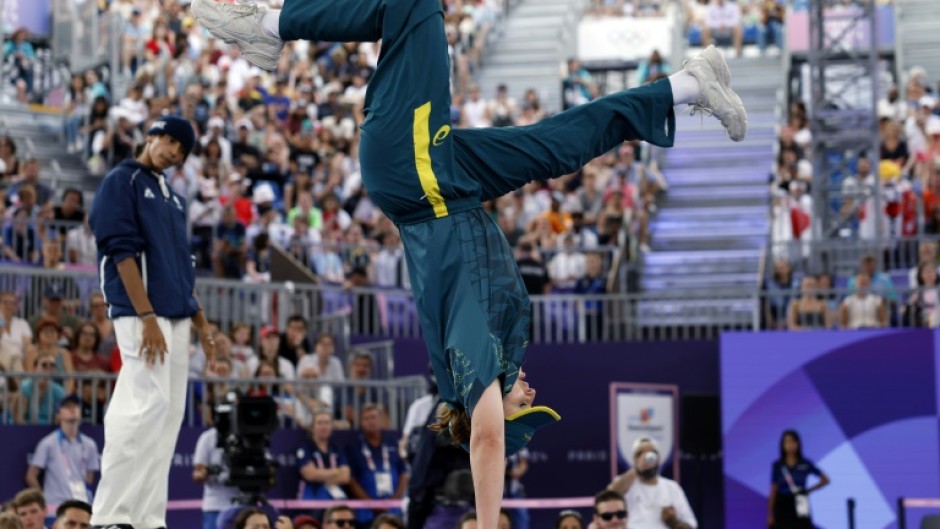 Australia's Rachael Gunn (R), known as Raygun, competes against France's Sya Dembele, known as Syssy, in the Olympic breaking