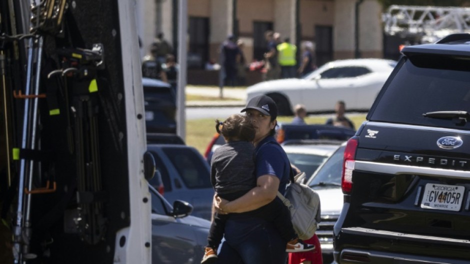 Parents arrive to pick up their children after the shooting took place at Apalachee High School in Winder, Georgia