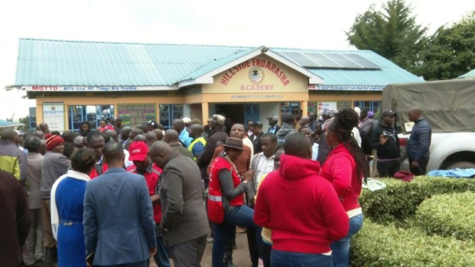 Parents gather outside Kenya primary school after fire kills 17 children