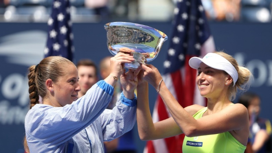 Champions: Bride-to-be Lyudmyla Kichenok (R) with Jelena Ostapenko pose with their trophy 