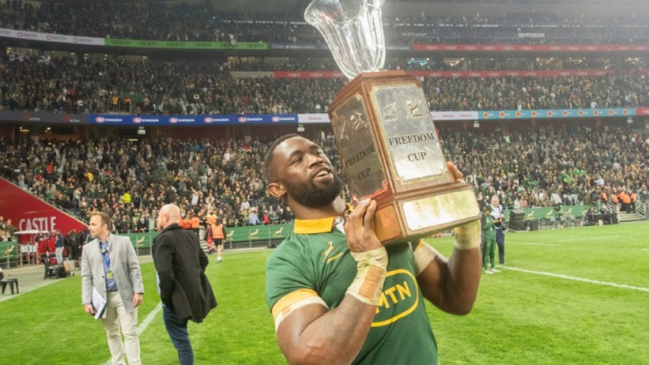 South Africa captain Siya Kolisi holds aloft the Freedom Cup after the Springboks beat New Zealand for the second time in eight days in the Rugby Championship 