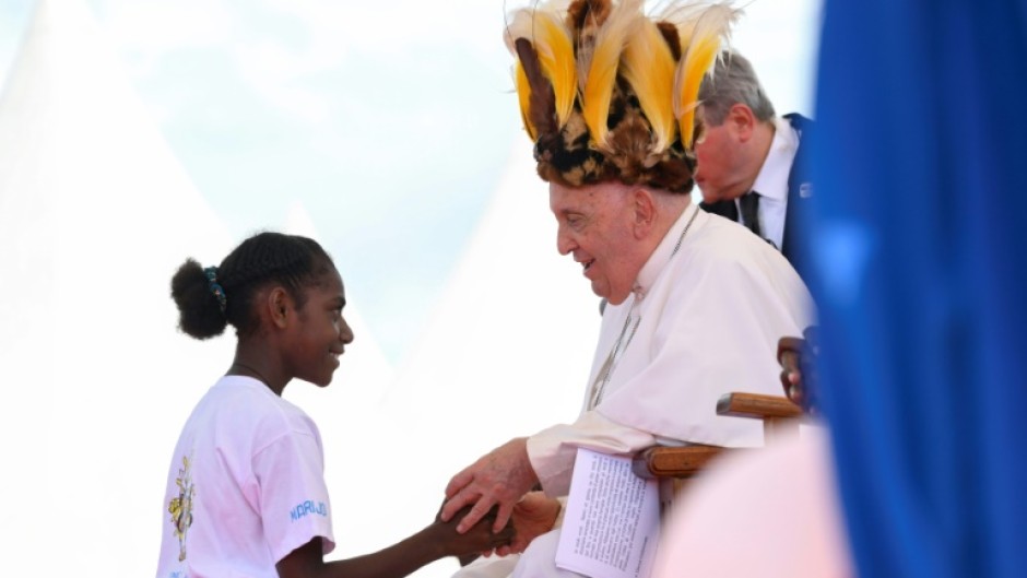 The pope's Asia-Pacific tour included a stop in Papua New Guinea, where he donned a traditional headdress