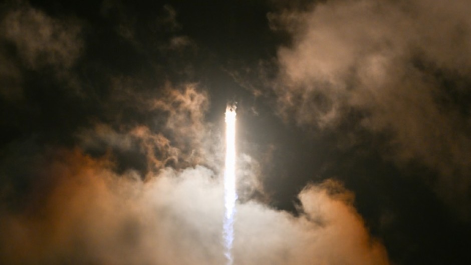 This still image taken from a SpaceX and Polaris broadcast on September 12, 2024, shows US fintech billionaire Jared Isaacman (EV1) peeking out to space from a hatch structure called "Skywalker", during the first private spacewalk 