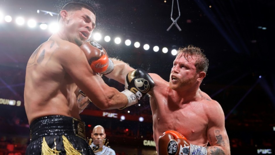 Saul 'Canelo' Alvarez lands a punch on the way to a unanimous decision victory over Edger Berlanga in their super middleweight world title bout