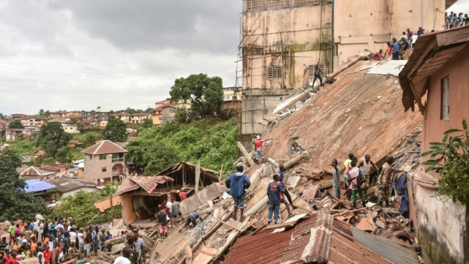 Large crowds gathered around the remains of the  structure