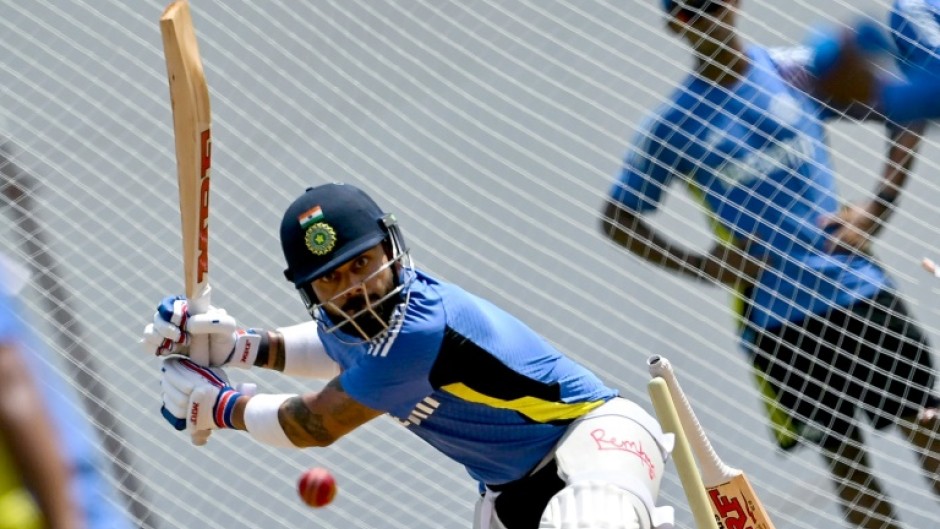 India's Virat Kohli bats in the nets during a practice session in Chennai ahead of their first Test against Bangladesh