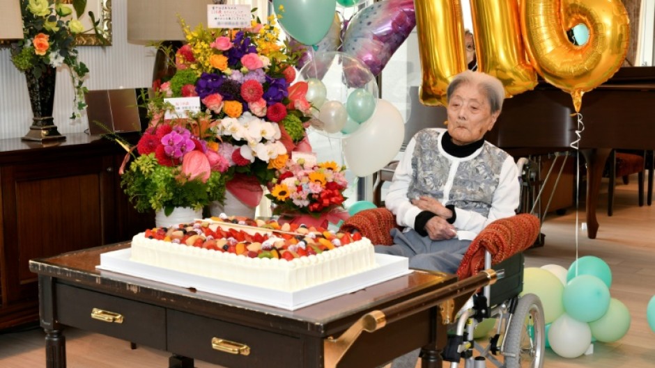 A handout photo taken on May 23, 2024  by the Ashiya City government shows Tomiko Itook, ebelieved to be the world's oldest living person, celebrating her 116th birthday