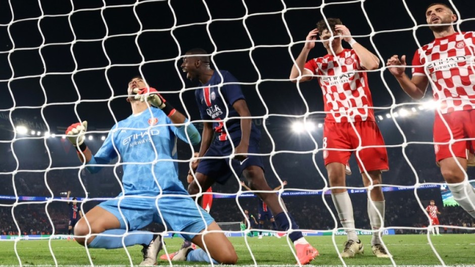 Girona goalkeeper Paulo Gazzaniga (L) made a costly error in the final minute to gift PSG victory 