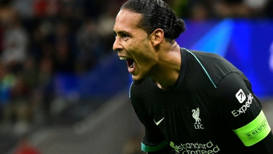 Liverpool defender Virgil van Dijk celebrates scoring against AC Milan