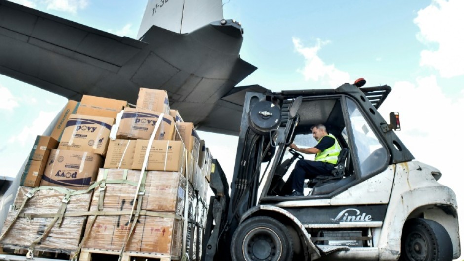 A shipment of emergency medical aid provided by Iraq is unloaded at Beirut International Airport