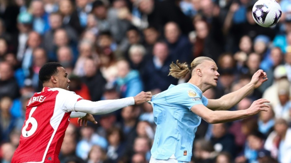 Arsenal must stop an in-form Erling Haaland (right) as the Premier League's top two face off on Sunday