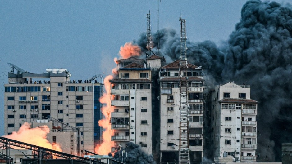 October 7, 2023: a ball of fire and smoke after an Israeli air strike hits the Palestine Tower in Gaza City