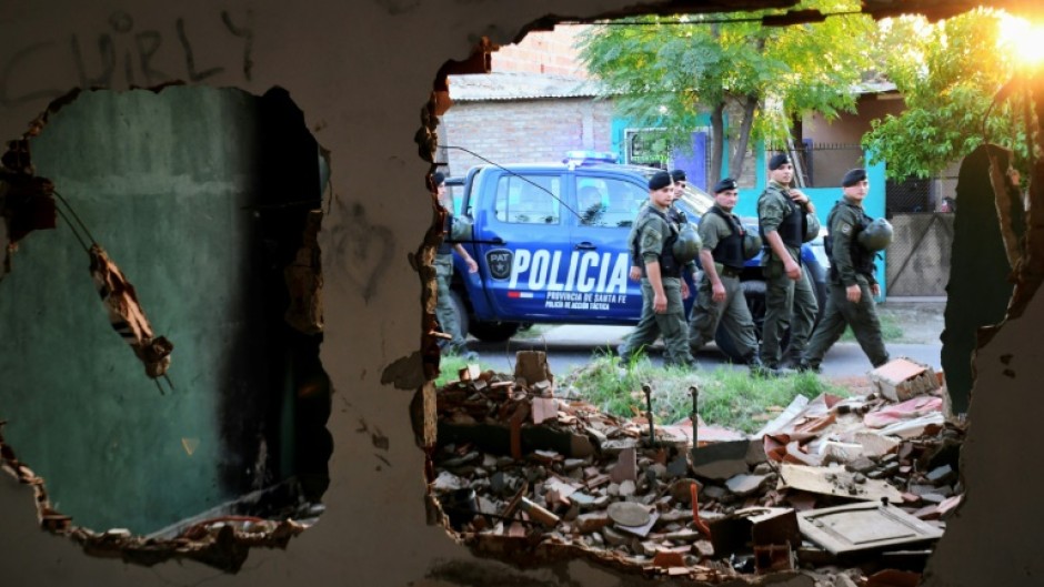 Members of Argentina's gendarmerie patrol the neighborhood of Los Pumitas, in the north of Rosario, Argentina on March 8, 2023