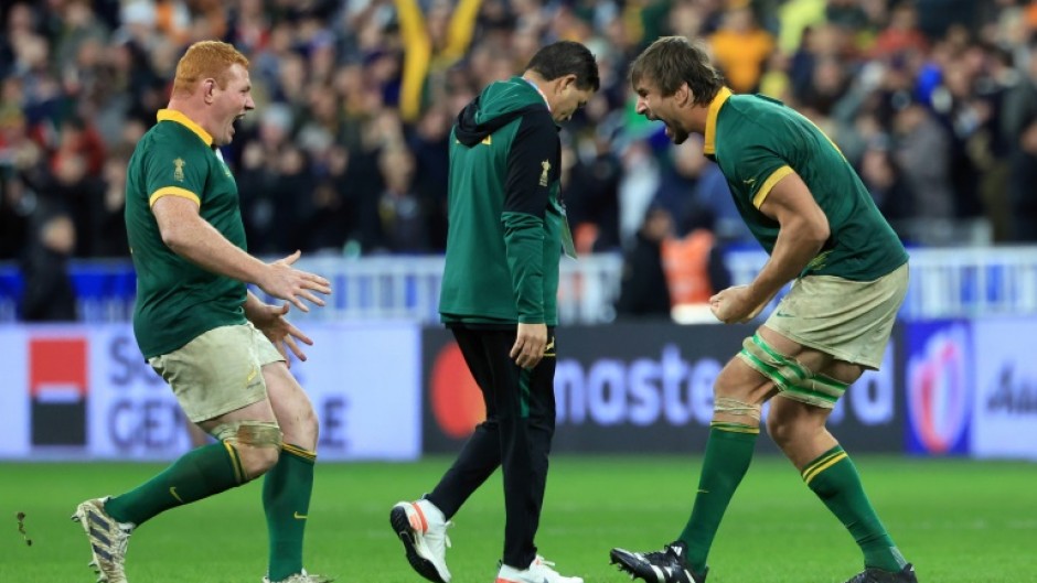 Eben Etzebeth (R) and Steven Kitshoff celebrate after South Africa beat New Zealand in the 2023 Rugby World Cup final in Paris.