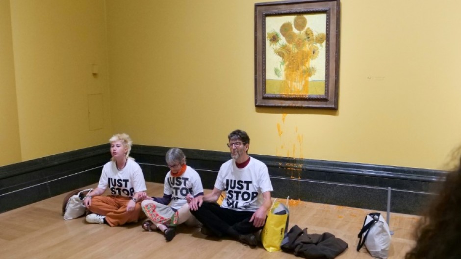 Three climate activists were detained after throwing soup on two Vincent van Gogh paintings in London