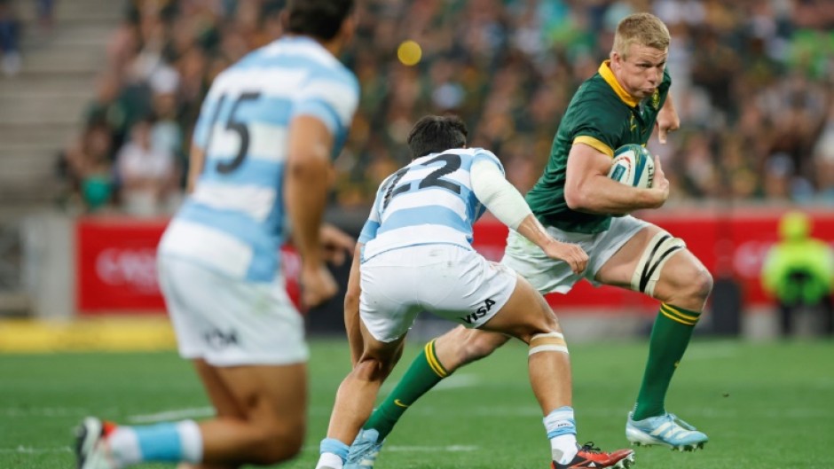 South Africa flanker Pieter-Steph du Toit (R) charges toward the Argentina try-line in Mbombela.