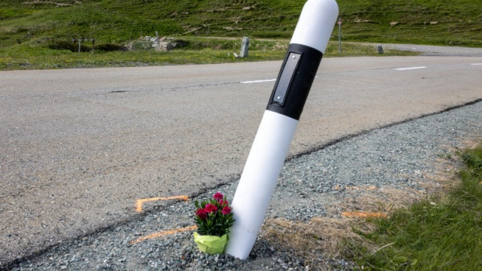 Fans laid flowers by the curve where  Gino Maeder suffered a fatal fall  during a high-speed descent on the Tour of Switzerland in 2023