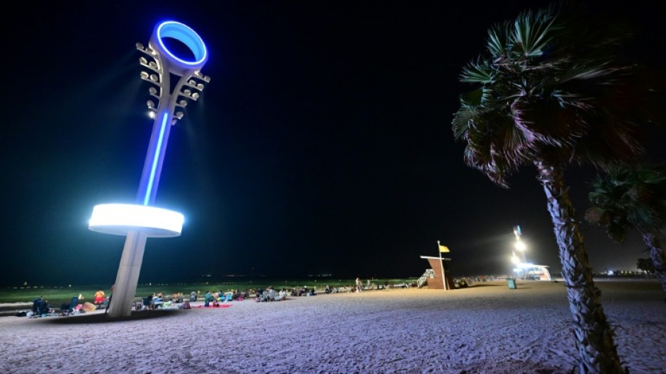 Floodlights illuminate the Umm Suqeim beach in Dubai to make it safer for beachgoers at night when the scorching heat of the Gulf has abated