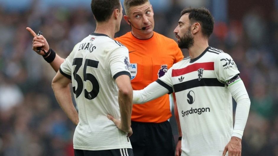 Defender Jonny Evans (left) helped Manchester United battle to a 0-0 draw against Aston Villa